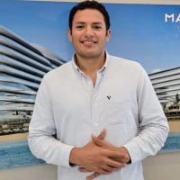 Smiling man in business casual at HireSDRs headquarters.