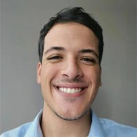 Smiling man representing professional sales development roles.